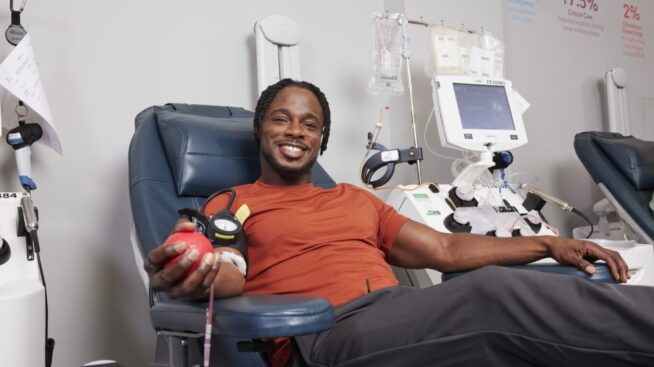 Smiling blood donor in donation chair at MBC location.