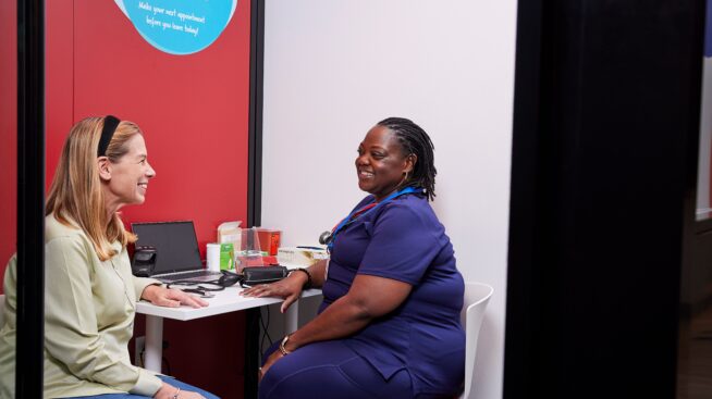 Blood donor asking questions about the types of donations with MBC representative.